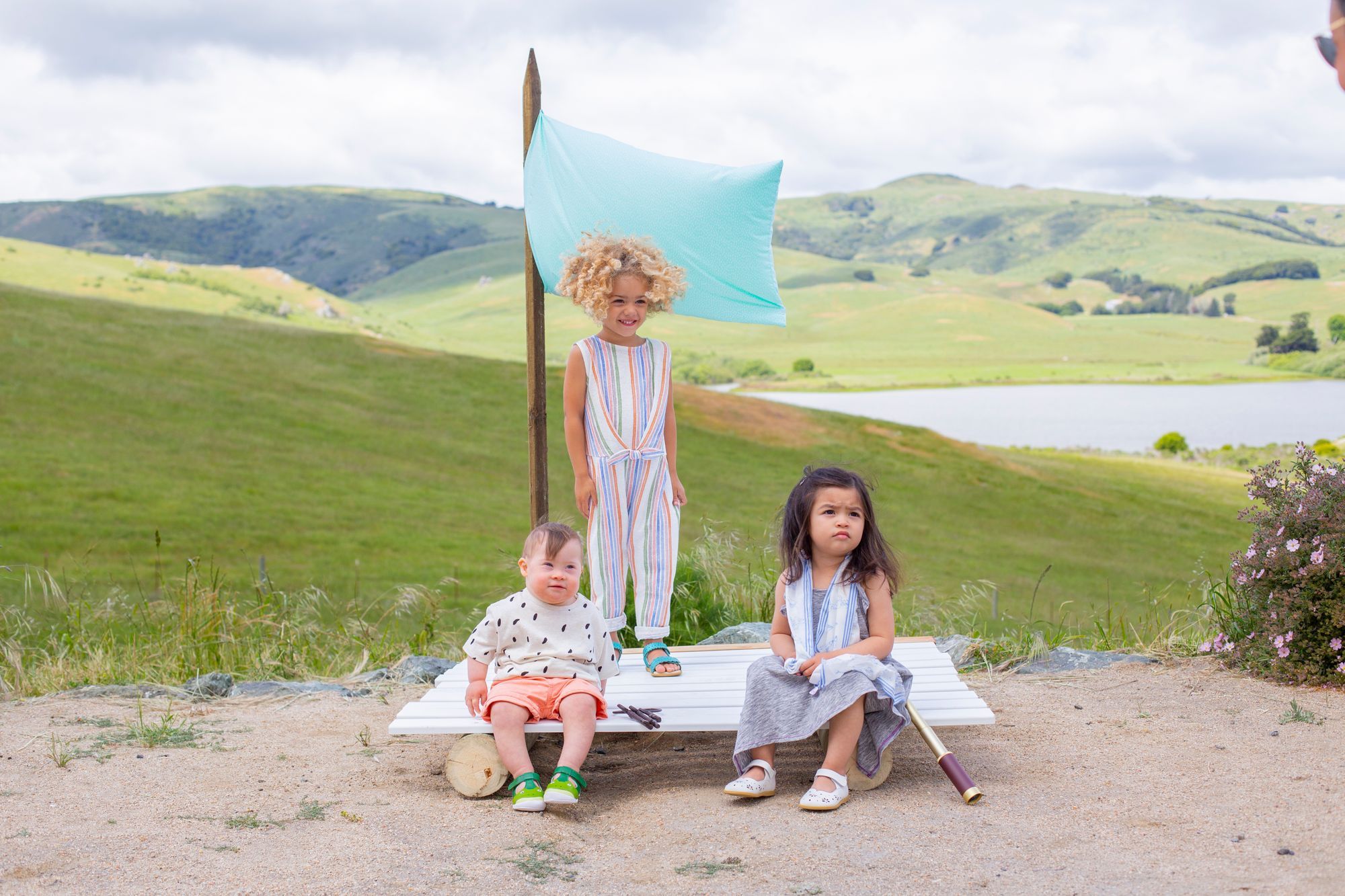 Three children on a makeshift raft